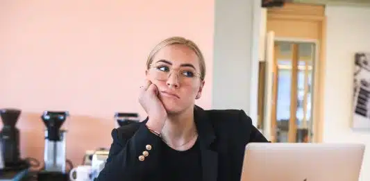 woman in black long sleeve shirt using macbook